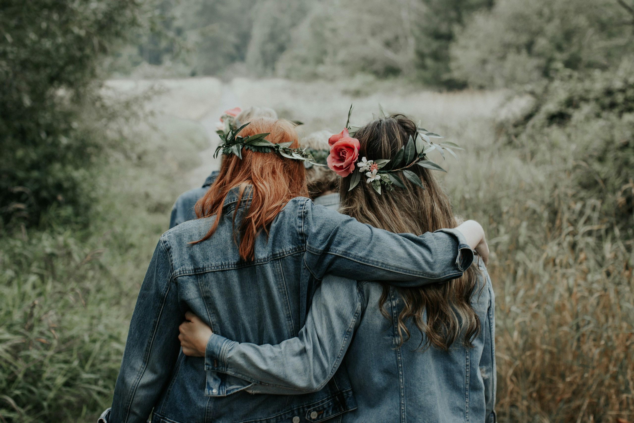 Flower grown girls wearing denim jackets